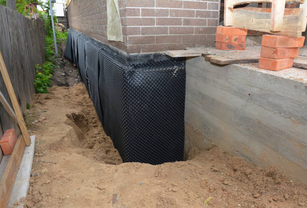 Happy homeowners after waterproofing job in Greenleaf